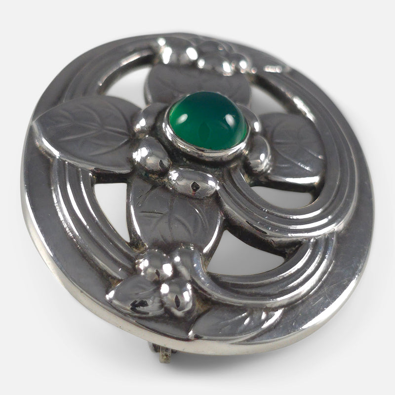 the brooch viewed side on