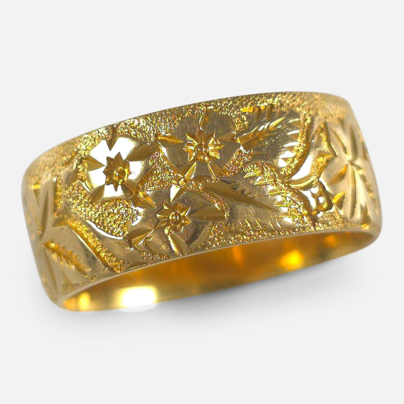 The Edwardian 18ct Gold Engraved Keeper Ring, viewed from above at an angle