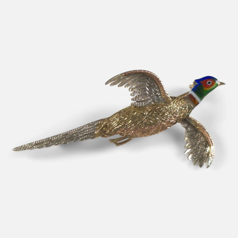 the brooch angled to appear like the pheasant is taking flight