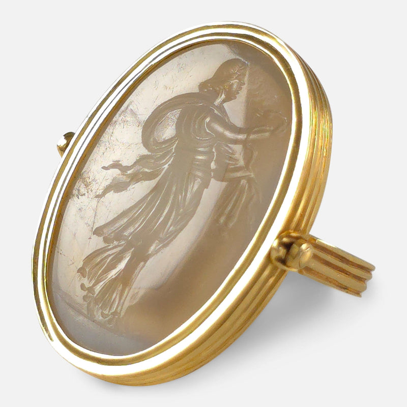 the ring rotated to be viewed from the right with the Hygieia Engraving in focus