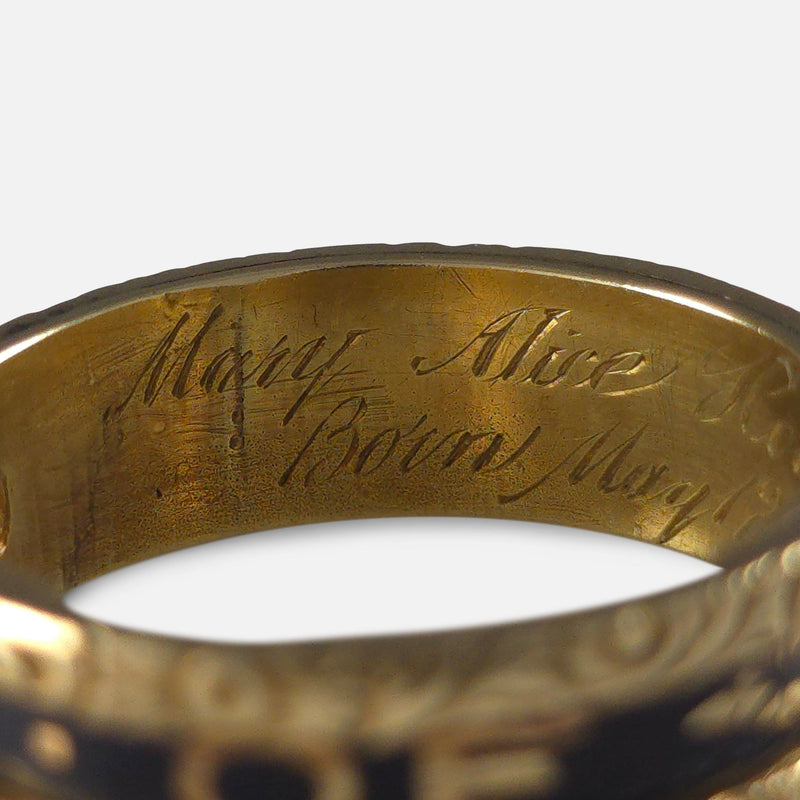 part of the inscription to the inside of the ring in focus