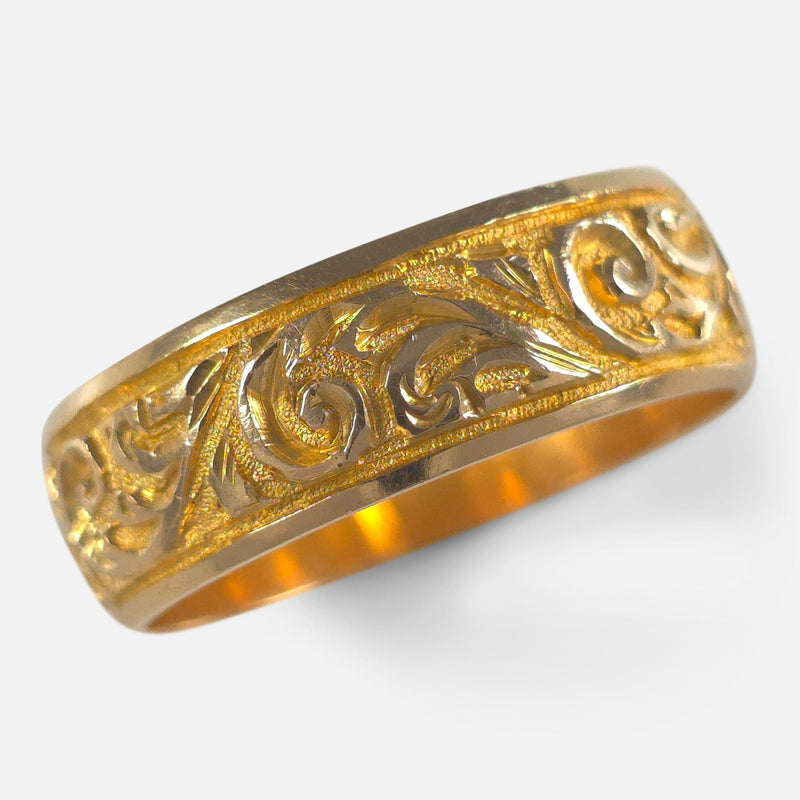 The Victorian 18ct Gold Engraved Keeper Ring, viewed diagonally from above